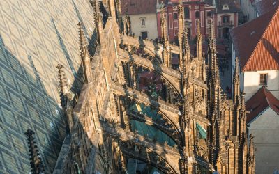 What did flying buttresses allow the architecture of the gothic church to do?   